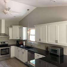 The bottom cabinets do not. Freshly Refinished White Kitchen Cabinets Shepard Painting Solutions Residential Commercial Painting Canton Oh