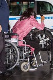 naomi cbell photoed in wheelchair at