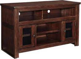 The stand should be at least 2 to 3 inches longer than the width of your tv to look balanced. Ashley Harpan 50 Inch Tv Stand Homemakers Furniture