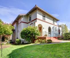 spanish style white large home front