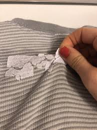 remove sticker residue from clothes