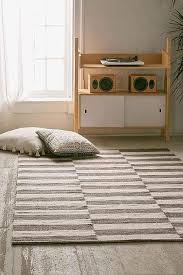 brown and white offset striped rug