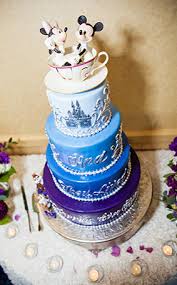 It appears like a classic, white wedding cake made up of square tiers…until tinkerbell appears by magic and sprinkles her fairy dust all over it. Disney Wedding Cakes Gallery Disney S Fairy Tale Weddings