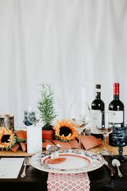 Present an interactive table display where food plays a role in the decor. How To Host The Best Italian Dinner Party Menu Tablescape Photos