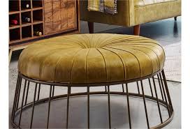 Radcliffe Round Leather Ottoman With Iron Base Sadler S Home Furnishings Ottomans