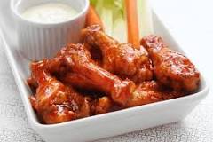 How do you get sauce to stick to wings?