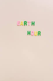 earth hour text over pink surface