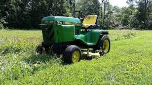 mowing a field with the john deere 316