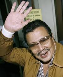 ... later” in the aftermath of a second Edsa &#39;revolution&#39;, deposed President Joseph Ejercito Estrada “was grimly posing for a mug shot in Camp Crame.” - erap_estrada
