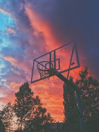 basketball court sunset clouds