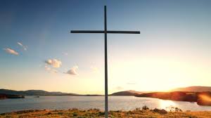 Cross of Jesus Christ near Water with Sunset and Peaceful Mood. Free Stock Video Footage Download Clips tranquility
