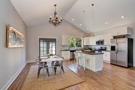 dining room with high vaulted ceiling