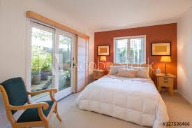 orange accent wall and french doors
