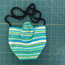 Use two different fabrics to designate a front and back, and bias tape to secure. Free Face Mask Pattern With No Pleats