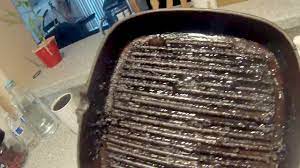 to clean charred cast iron grill pan