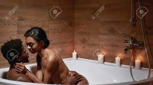 Romantic Evening. Young Sensual Naked African Couple Of Lovers Kissing  While Taking Foamy Bath With Candles Together Stock Photo, Picture and  Royalty Free Image. Image 163453271.