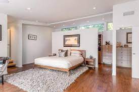 primary bedrooms with hardwood flooring