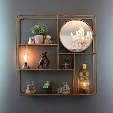 gold metal wall shelving unit with