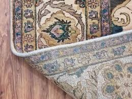 beige hand knotted woolen carpets size