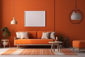 orange walls and a white framed picture