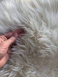 how to clean a sheepskin rug make it