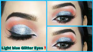 sky blue eye makeup with silver glitter