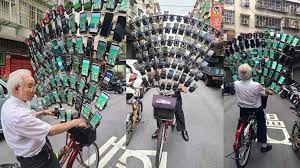 Taiwan's Pokémon GO Grandpa is back with 64 phones mounted on his bike
