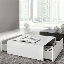 The bottom units each have a drawer for storage, while the upper ones are shelves. Box White Gloss Coffee Table With Drawers White Gloss Coffee Table White Coffee Table Modern Coffee Table White