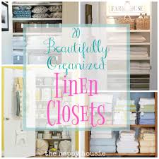A curved built in linen cabinet is fitted with glass front cabinets flanked by white drawers adorned with polished nickel pulls and white overhead cabinets. 20 Beautifully Organized Linen Closets The Happy Housie