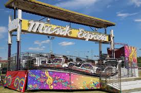 Riders must be at least 52 to ride alone. S T Magic Midways Musik Express