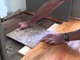 make tile flush with hardwood floor