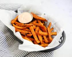 Made with baked, instead of fried, spicy sweet potato fries, with a scrumptious garlic mayo dip, it's the perfect stay at home snack or appetizer! Crispy Baked Sweet Potato Fries Video I Heart Naptime