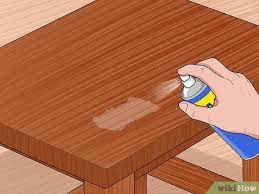how to clean tape adhesive from wooden