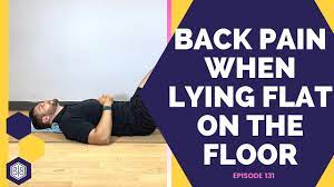 lower back pain when lying flat