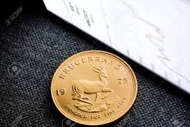 Closeup Of Golden Southafrican Krugerrand Coin With A Chart Reflection