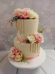drip cake with artificial flowers