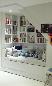 Make those stairs work double duty by mounting hooks to hang your outerwear. 25 Libraries And Reading Nooks Under Stairs Digsdigs
