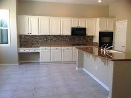 We service our clients happily in las vegas, summerlin, henderson and surrounding areas. Las Vegas Flat Screen Over Fireplace Traditional Kitchen Beige And Brown Tile Kitchen Floors Walls Black Appliances Granite Countertops Cabinet