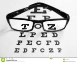 Glasses With Black Frame And Eye Test Chart Stock Photo