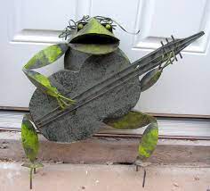 Metal Frog Sculpture Playing Guitar