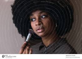 black woman recording beauty video a