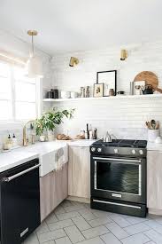 gray oak kitchen with kitchenaid black