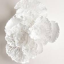Due to the handcrafted nature of this item, expect slight variation in the appearance of each unique piece. White Ceramic Flower Wall Art