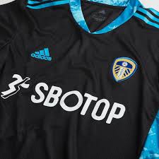 The classic white home kit has been paired with a lovely green and navy striped away shirt with a gold trim. The Terrace On Twitter The Leeds United 20 21 Goalkeeper Kit Has Appeared On The Clubs Store What Do You Think Lufc Leedsunited