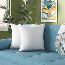 Green maze pattern pillows on a white slipcovered sofa against a wall styled with a green and white wall art gallery. Blue White Throw Pillows You Ll Love In 2021 Wayfair