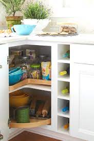 how to organize a corner cabinet for