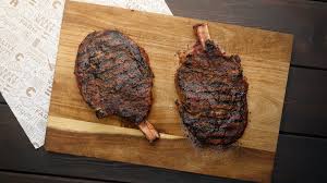 dry aged cowboy ribeye steaks grilled