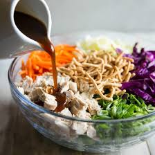 This crunchy chinese chicken salad is quick, refreshing and satisfying, loaded with crisp, vibrant veggies, crunchy wonton strips and nuts all doused in tangy sesame ginger dressing! Asian Chicken Salad Recipe