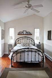A cream painted iron bed is beautiful dressed in gray and yellow. Tan Bedroom Beauty Conservative But Fun Bedrooms Decor Around The World Wrought Iron Bed Black Bedroom Furniture Home