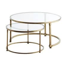 round brass coffee table with glass top